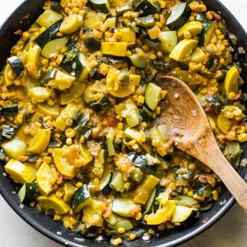 Cooked calabacitas in a large skillet.