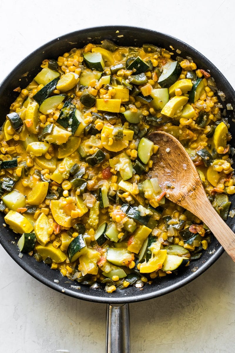 Cooked calabacitas in a large skillet.