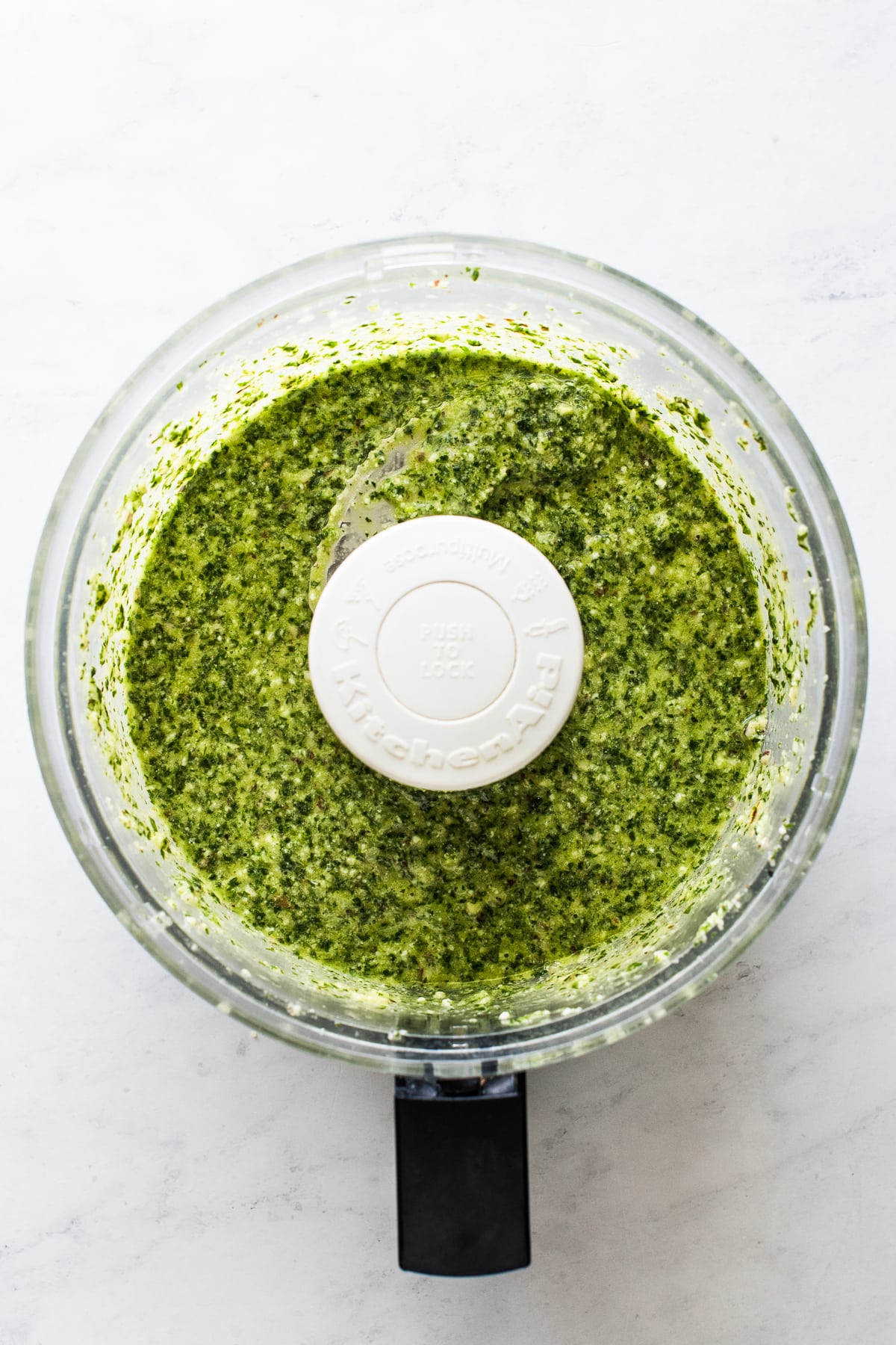 Cilantro pesto in a food processor already blended.