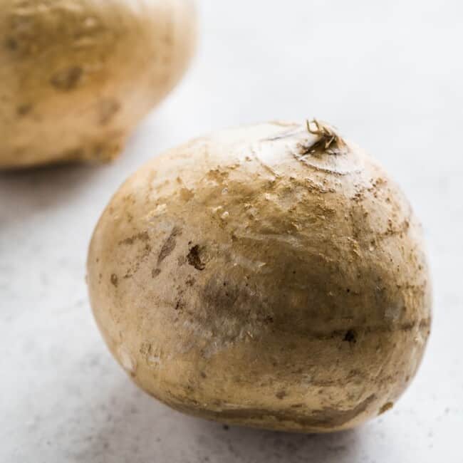 A jicama on a table.