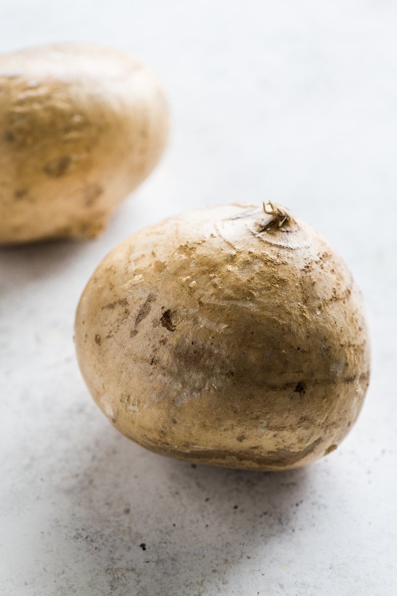 A jicama on a table.