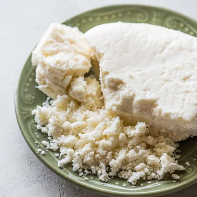 Crumbled queso fresco on a plate.