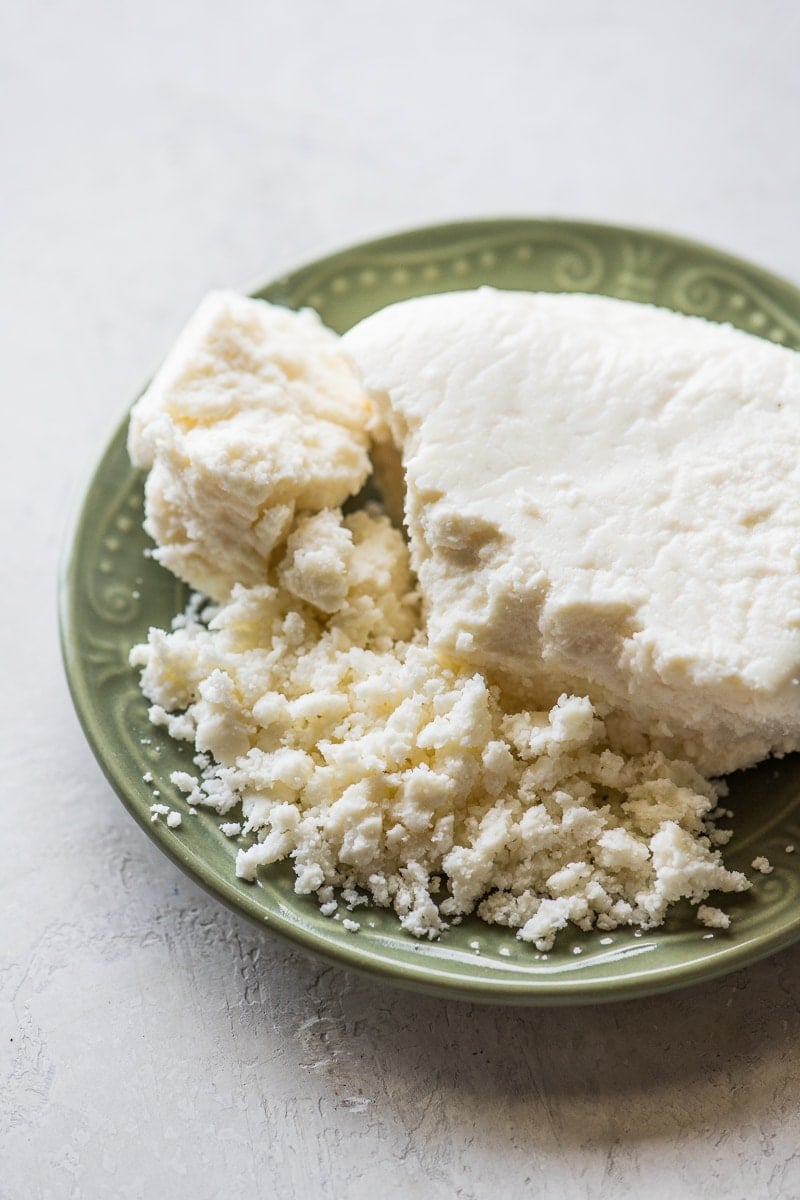 Crumbled queso fresco on a plate.