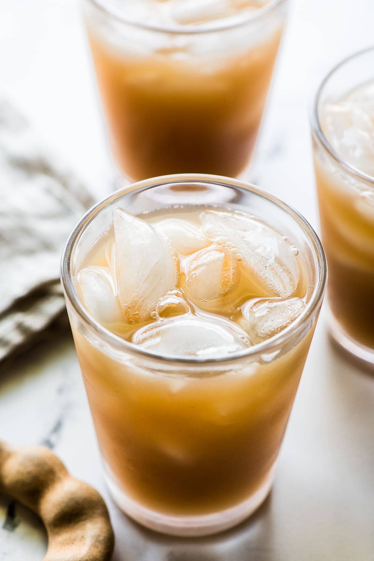 Agua de Tamarindo drink in a glass with ice.