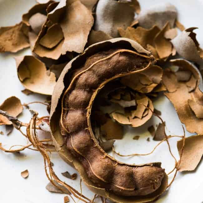 An open tamarind pod for agua de tamarindo.