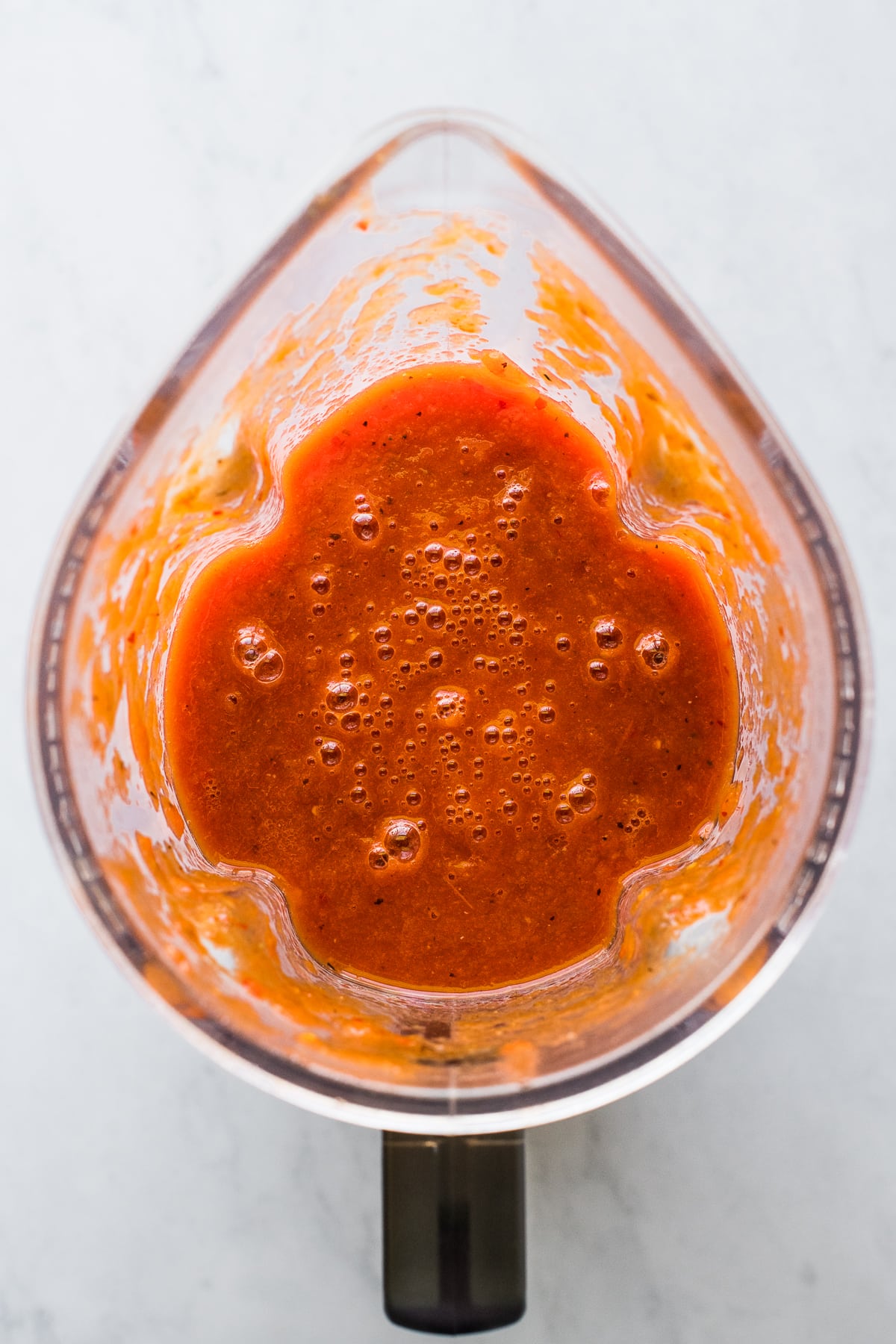 Red chile sauce in a blender for tortas ahogadas.