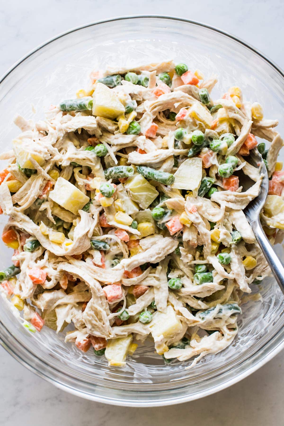 Ensalada de pollo in a mixing bowl.