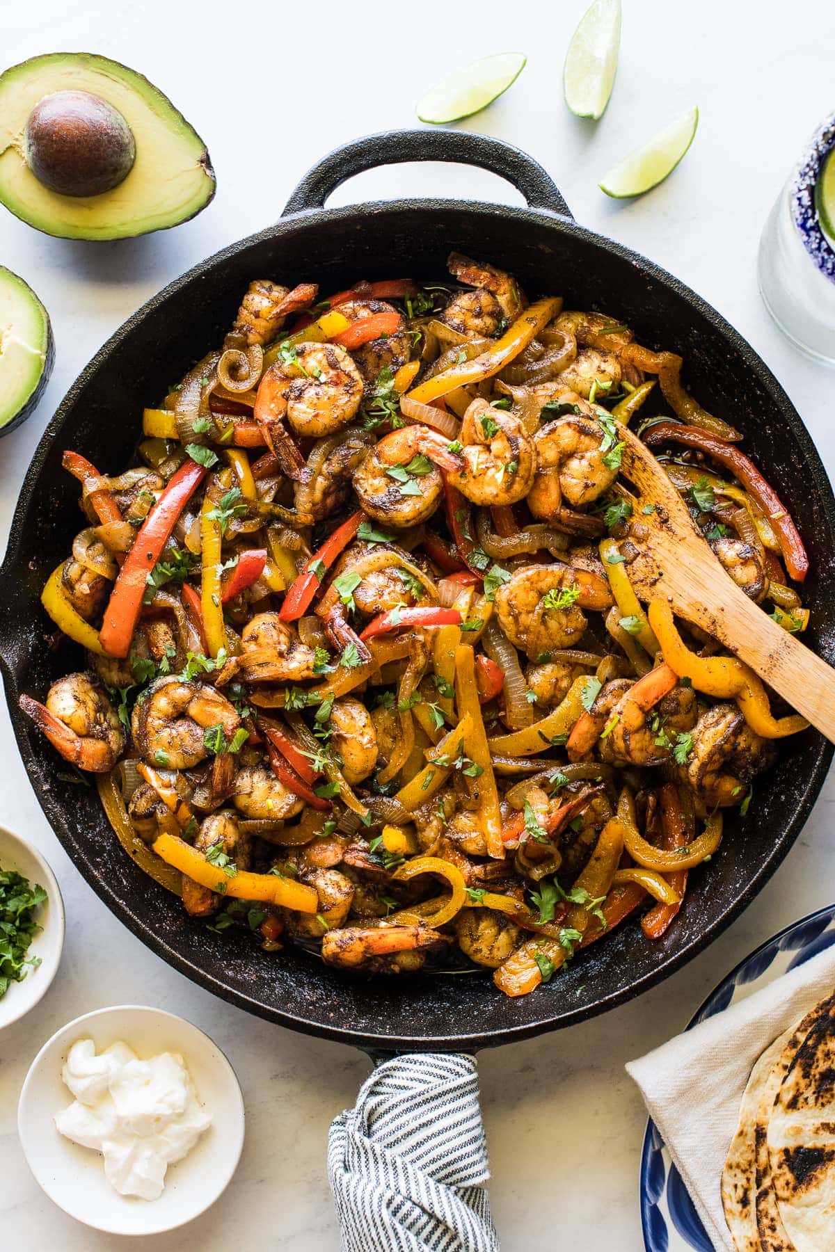 Shrimp fajitas in a skillet.