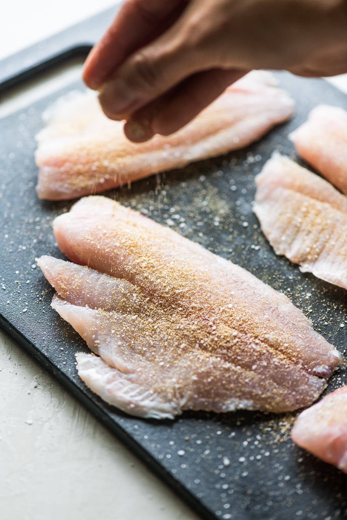 Tilapia fillets seasoned for tacos.