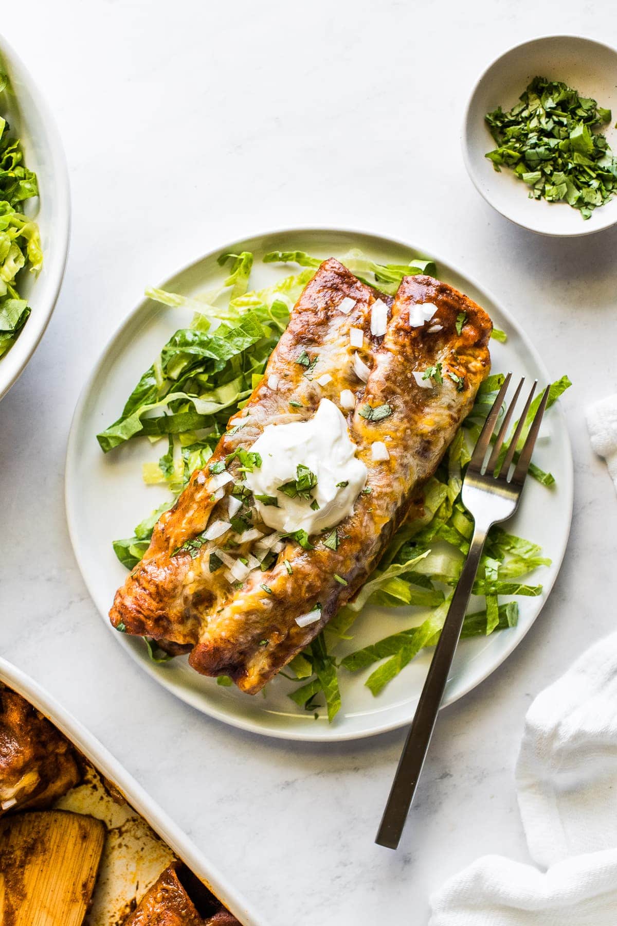 Beef Enchiladas on a plate ready to eat.