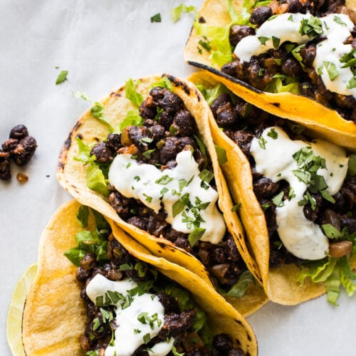 Black Bean Tacos topped with crema and chopped cilantro.