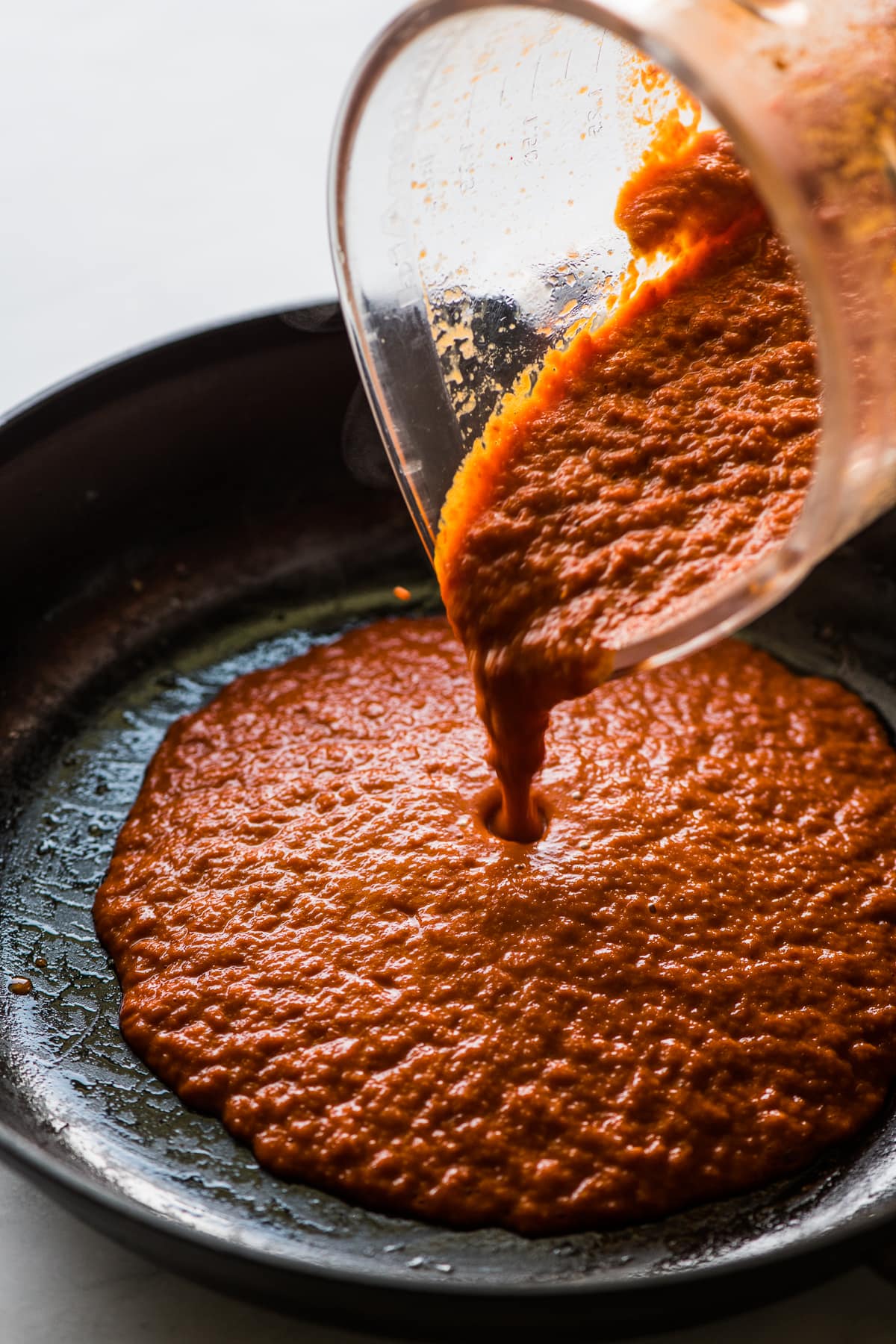 Salsa in a skillet for huevos ahogados.