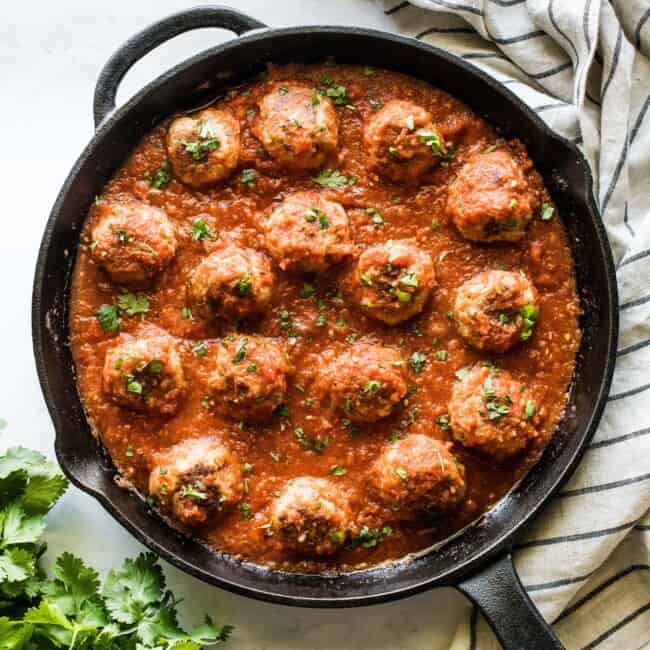 Mexican meatballs made from pork in a cast iron skillet.