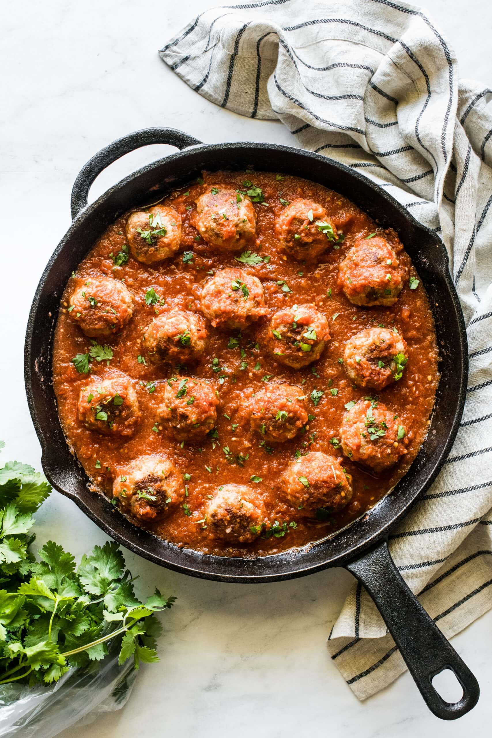 Mexican meatballs made from pork in a cast iron skillet.
