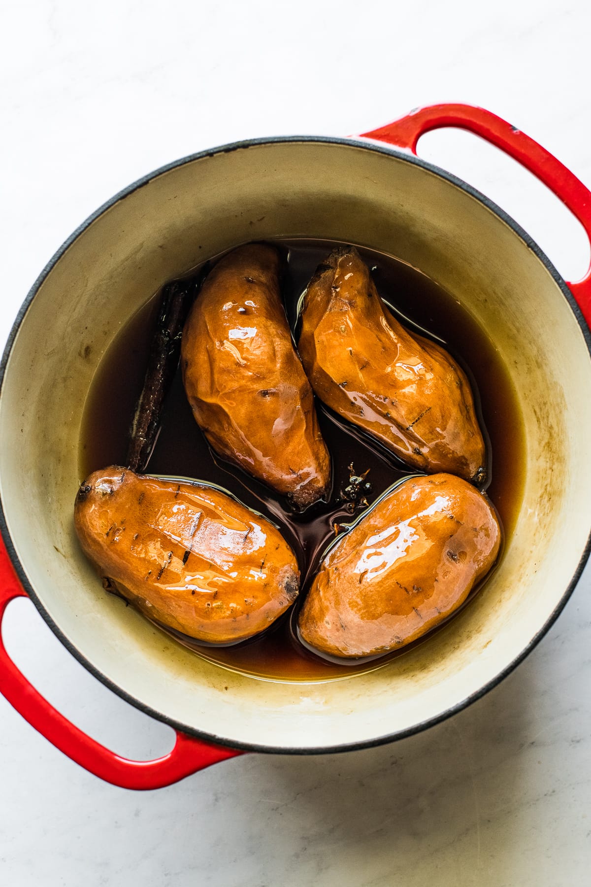 Cooked camotes enmielados in a dutch oven.