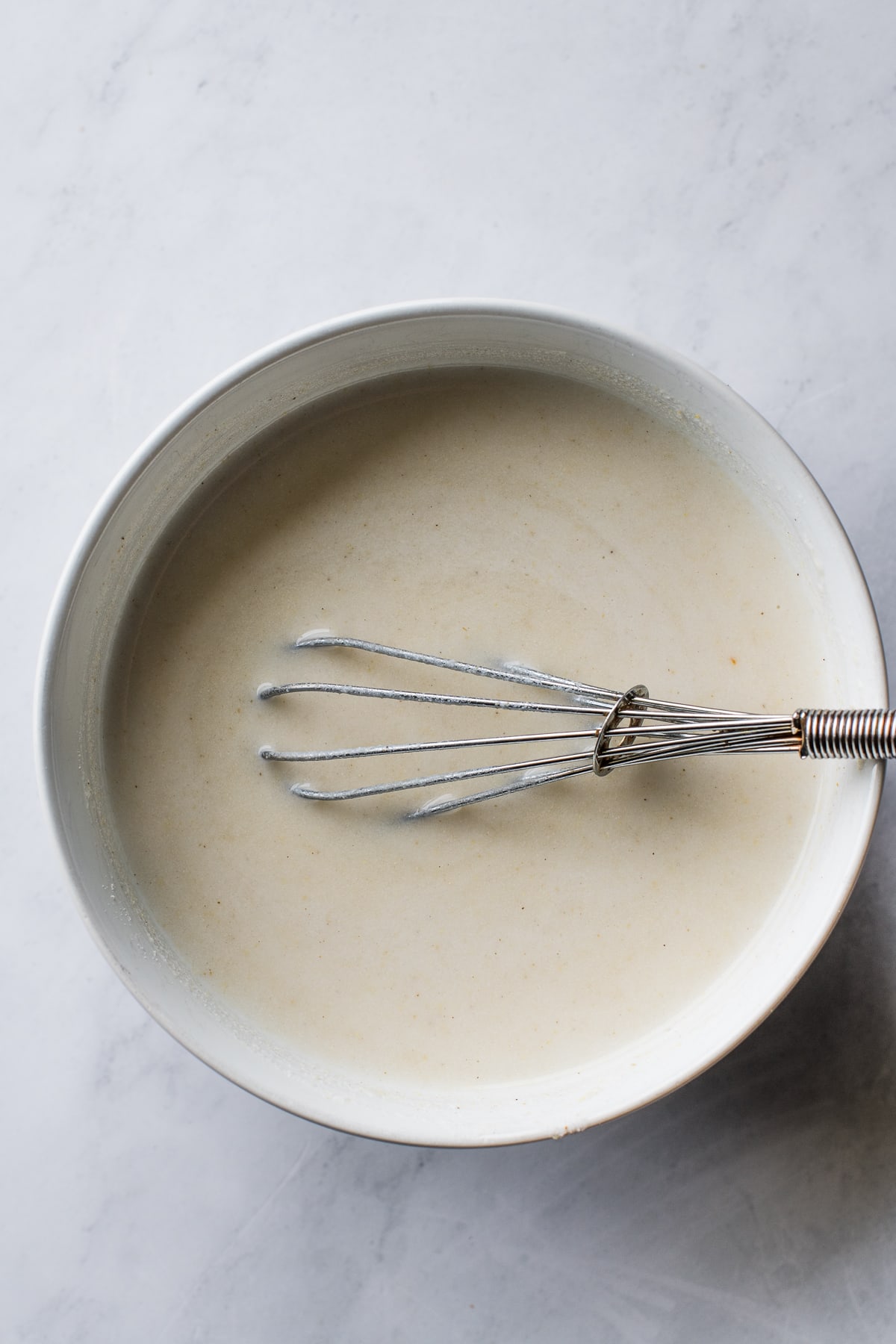 A bowl with whisked masa harina and water for atole.