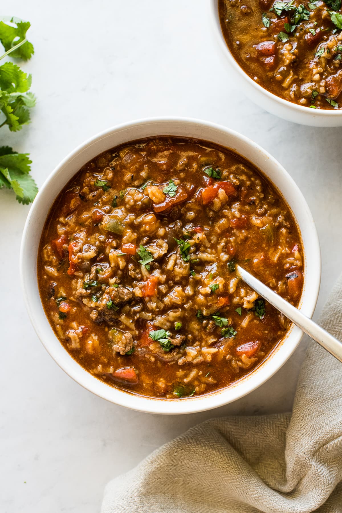 Stuffed pepper soup in a bowl garnished with cilantro.