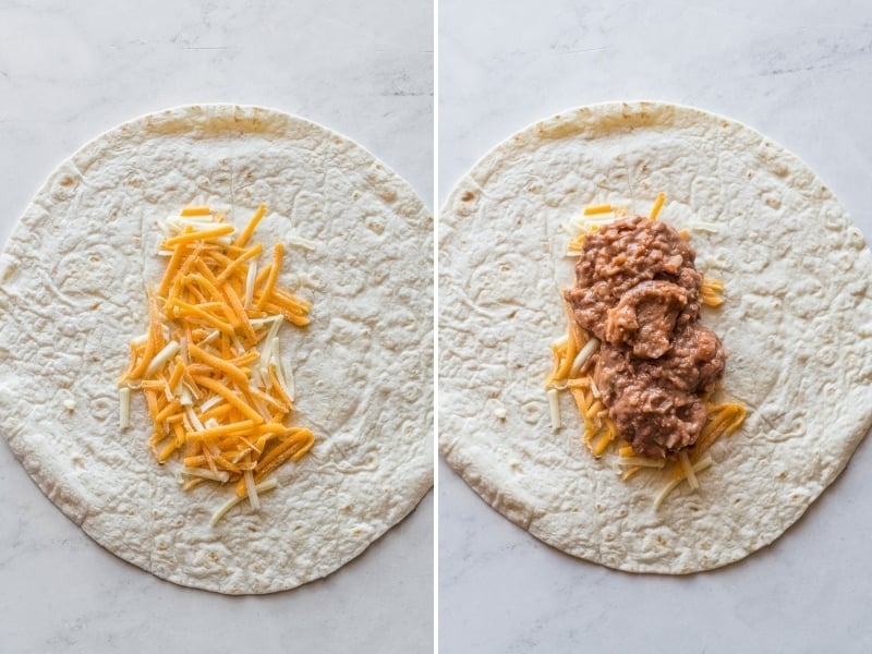 A flour tortilla topped with shredded cheese and refried beans.