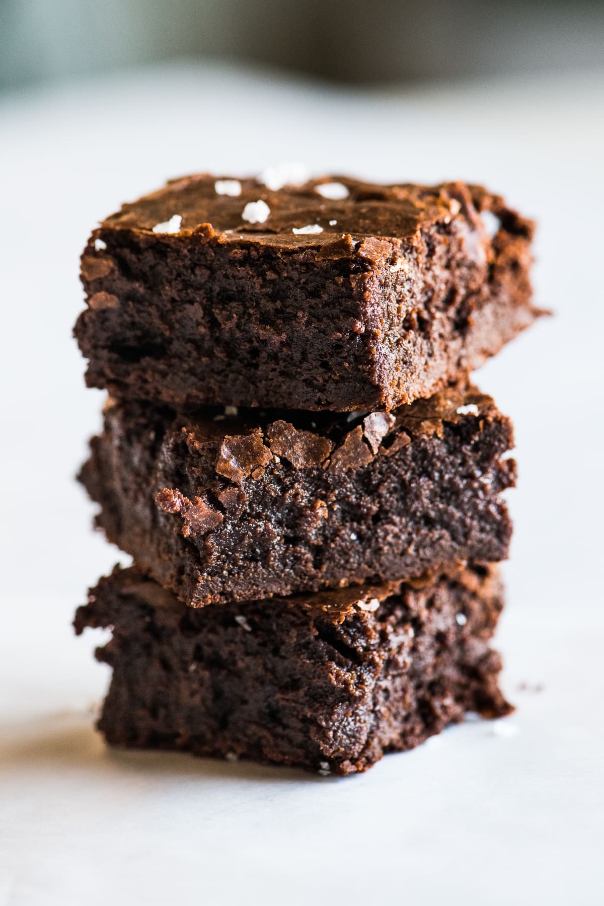 Three fudgy Mexican brownies stacked on top of one another.