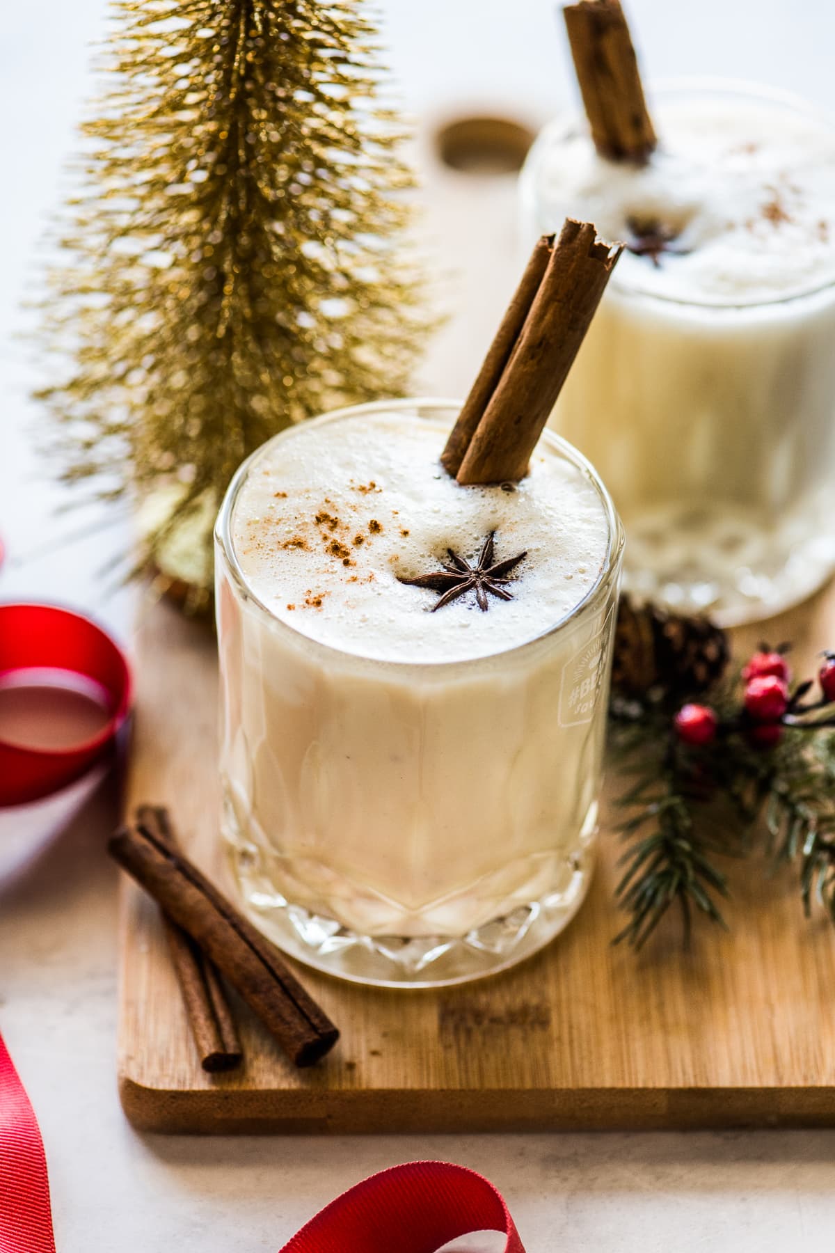 Rompope in a glass topped with cinnamon.