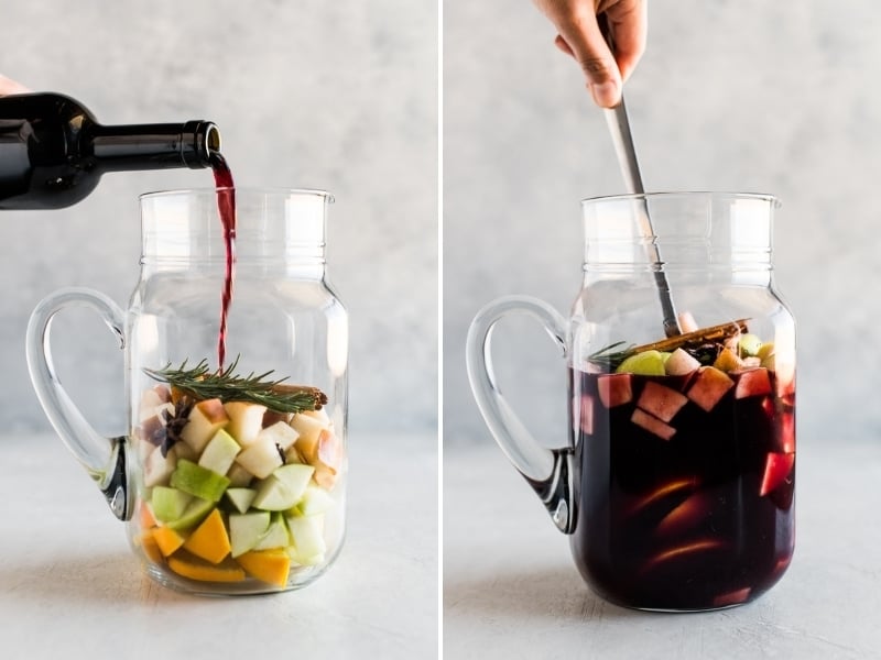 Winter sangria in a pitcher being mixed together.