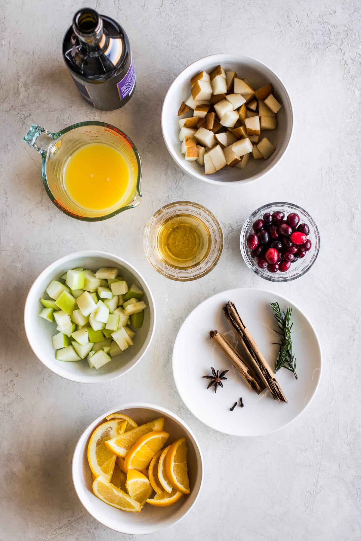 Ingredients in winter sangria on a table.