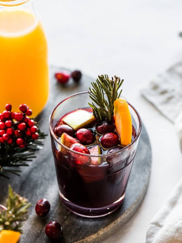 A cup of winter sangria made with red wine, fruit, and spices.