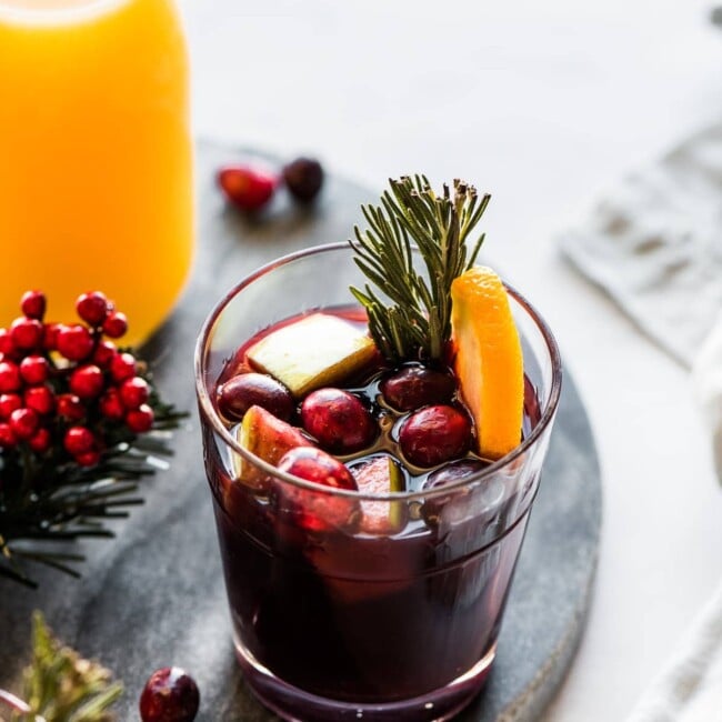 A cup of winter sangria made with red wine, fruit, and spices.