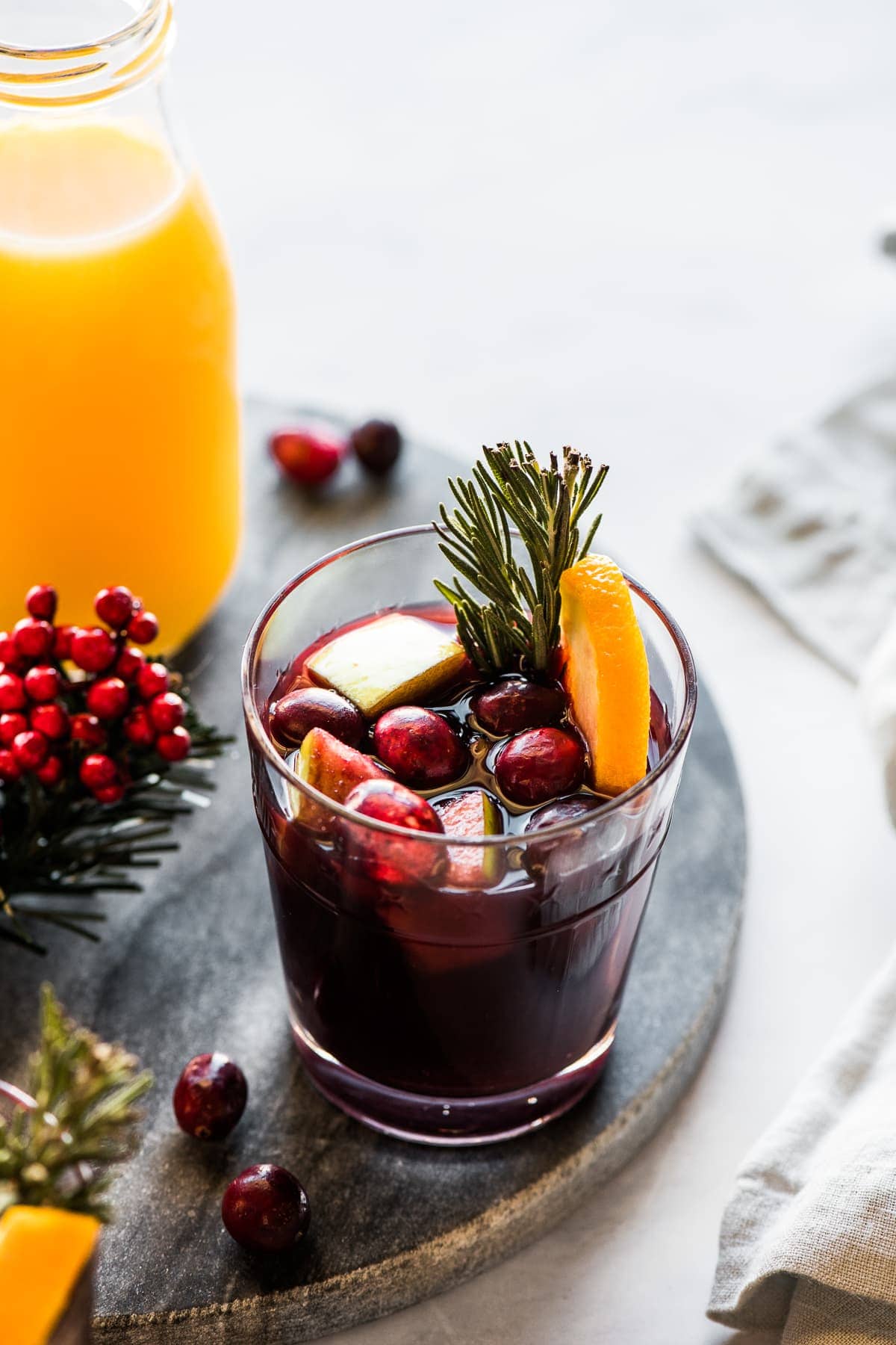 A cup of winter sangria made with red wine, fruit, and spices.