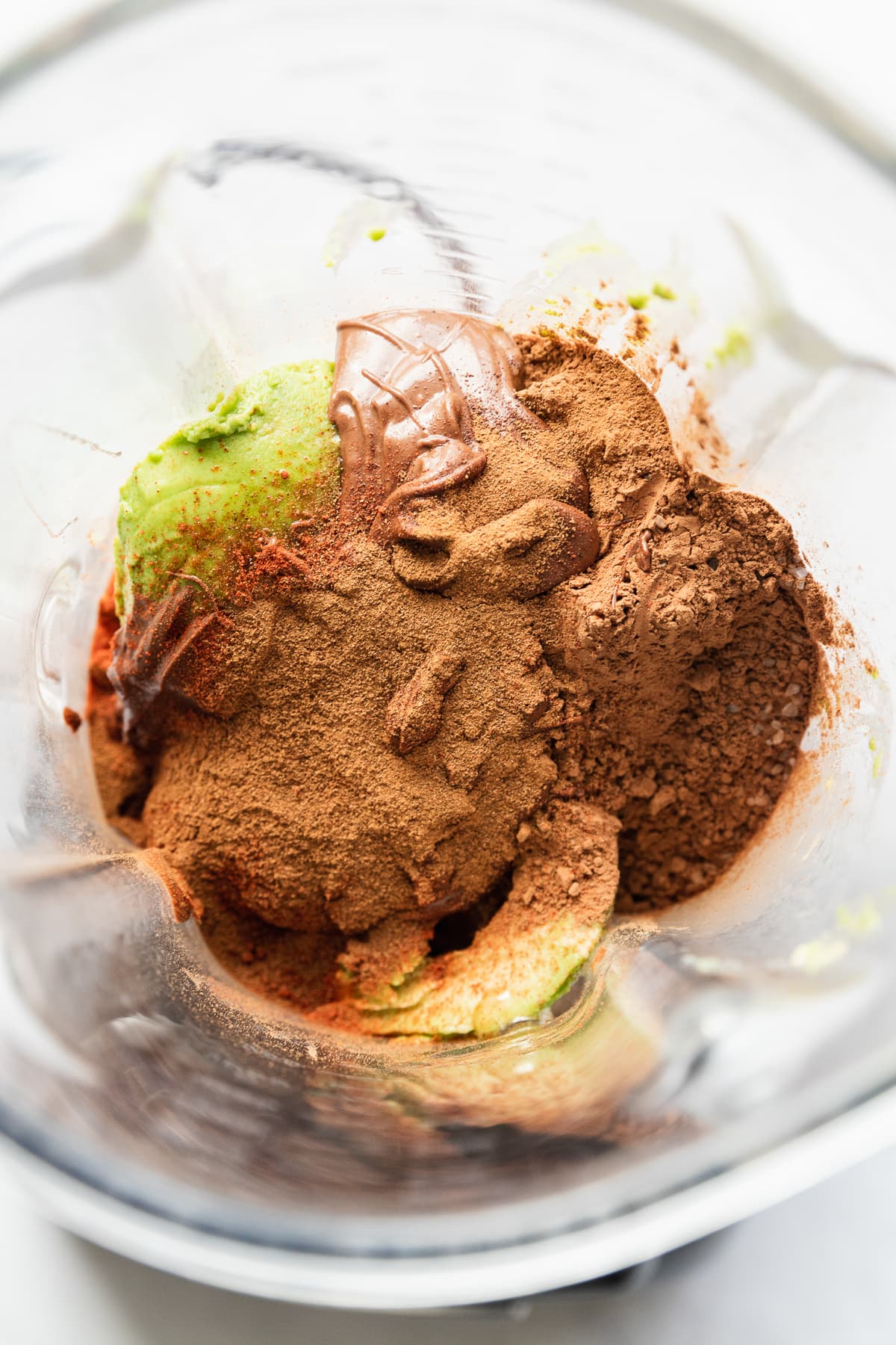 Ingredients for Avocado Chocolate Mousse in a blender.