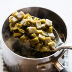 Cooked nopales on a spoon.