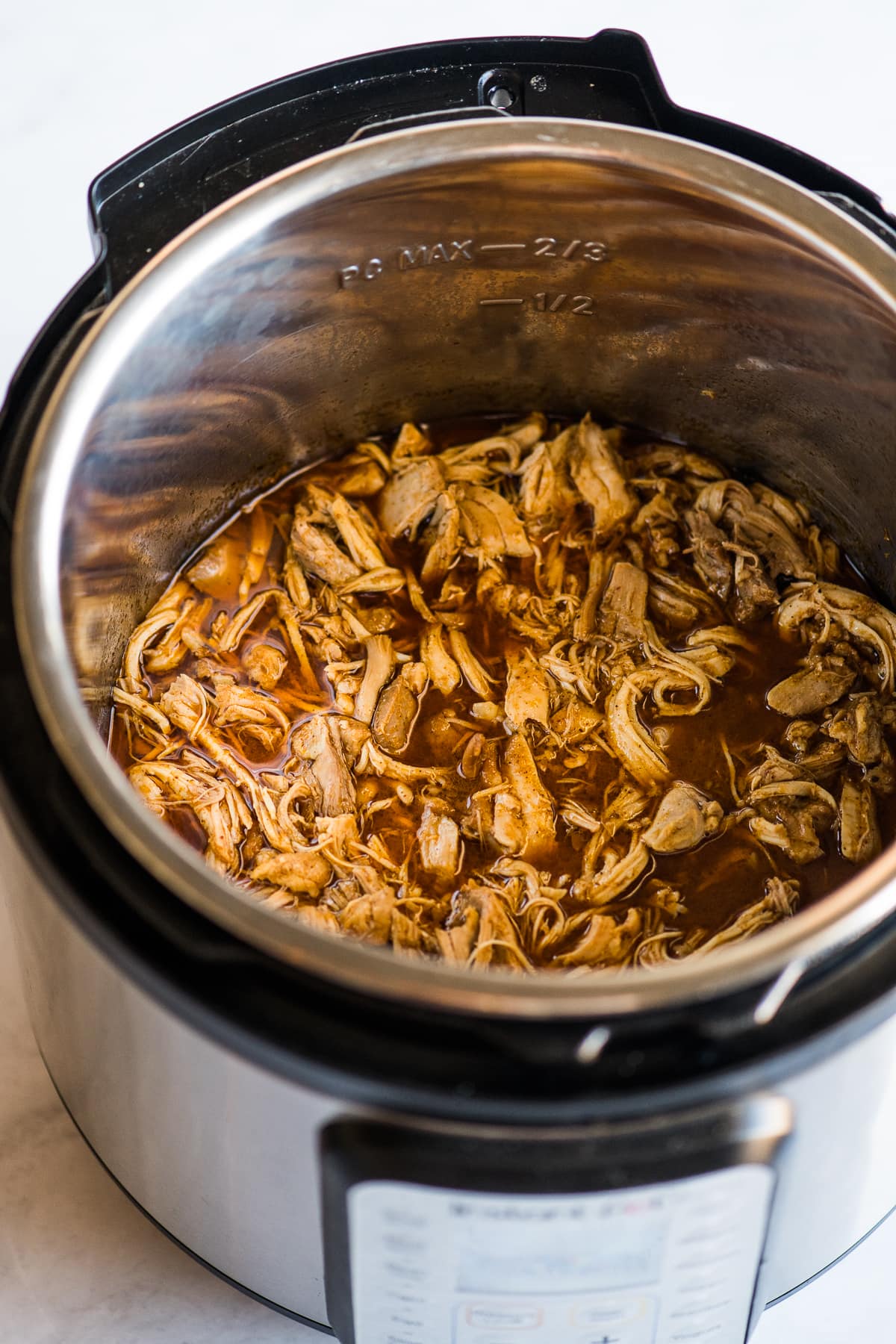 Shredded chicken thighs in the Instant Pot pressure cooker for tacos.