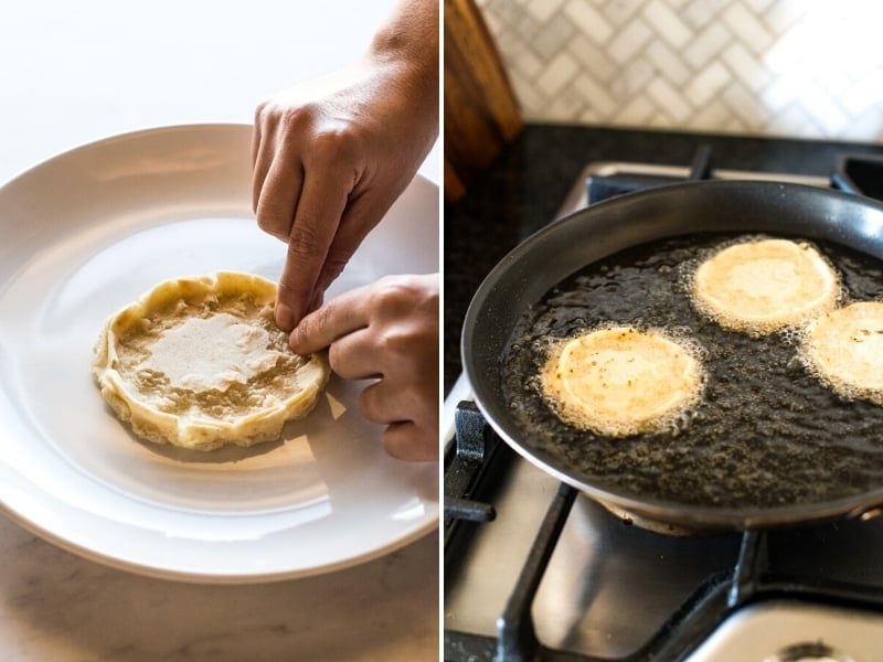 A hand forming sopes and then frying them in a skillet.