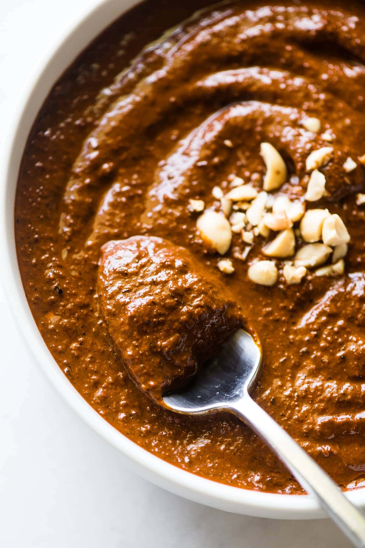 Salsa Macha in a bowl with a spoon in it.