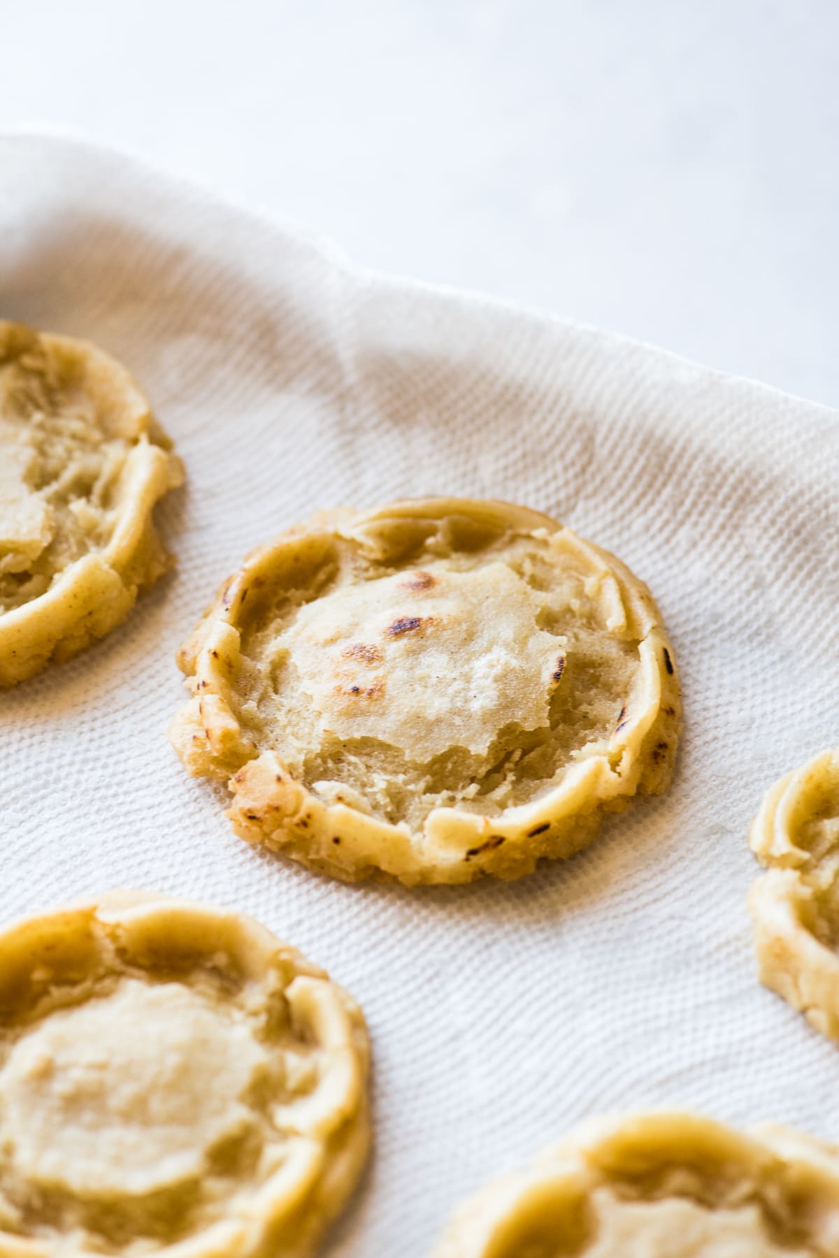 Fried sopes on paper towels to drain off excess oil.