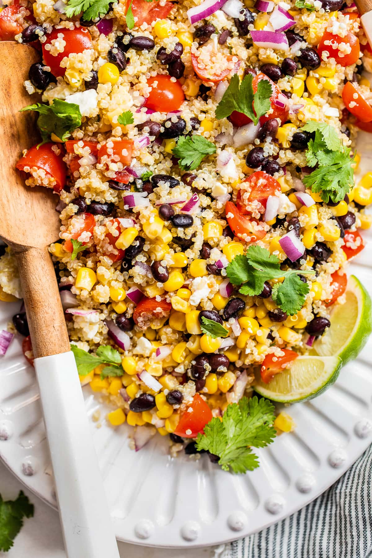 Salad made from quinoa, corn, black beans, tomatoes, and cotija cheese.