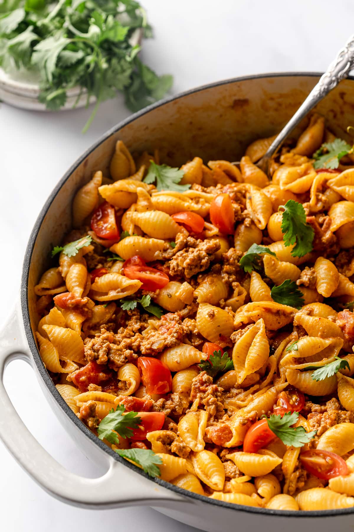 Easy taco pasta in a skillet ready to be eaten.