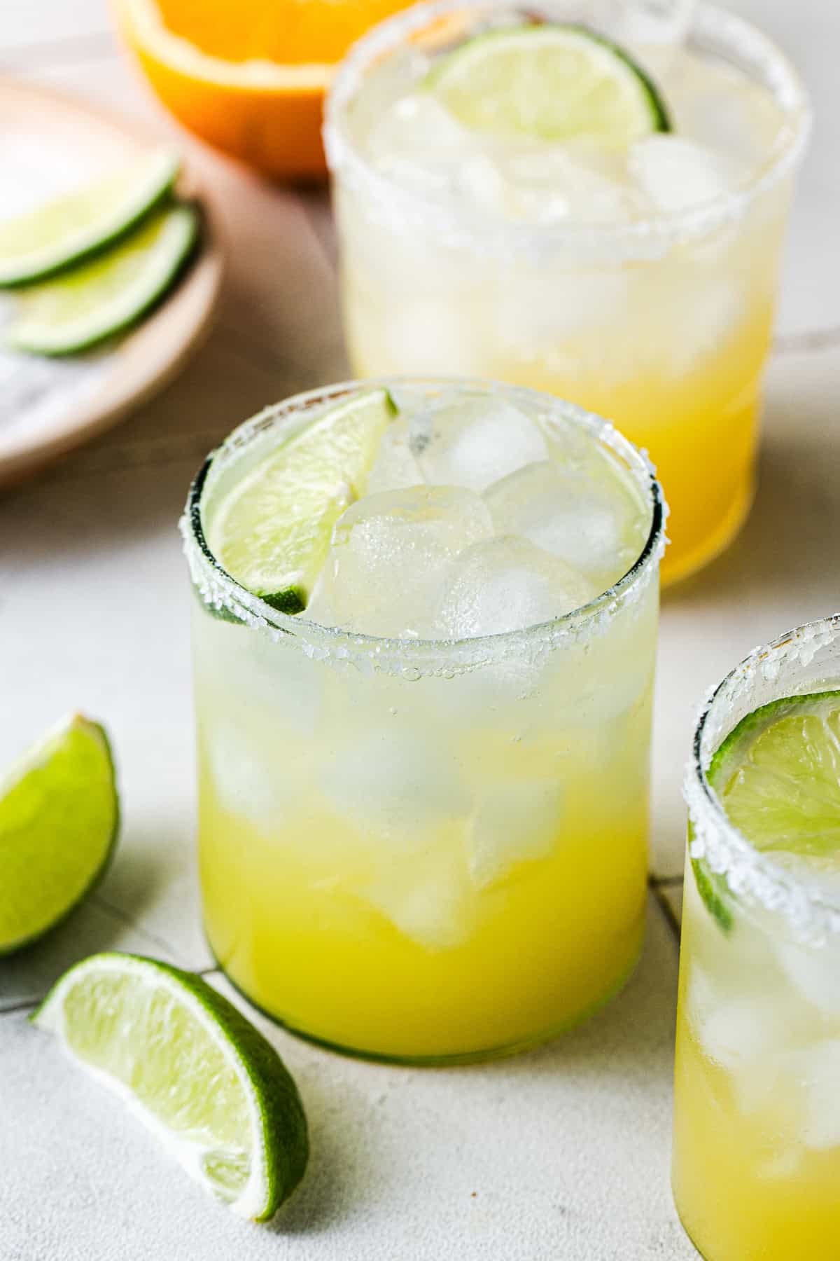 3 margarita mocktails on a table ready to drink.
