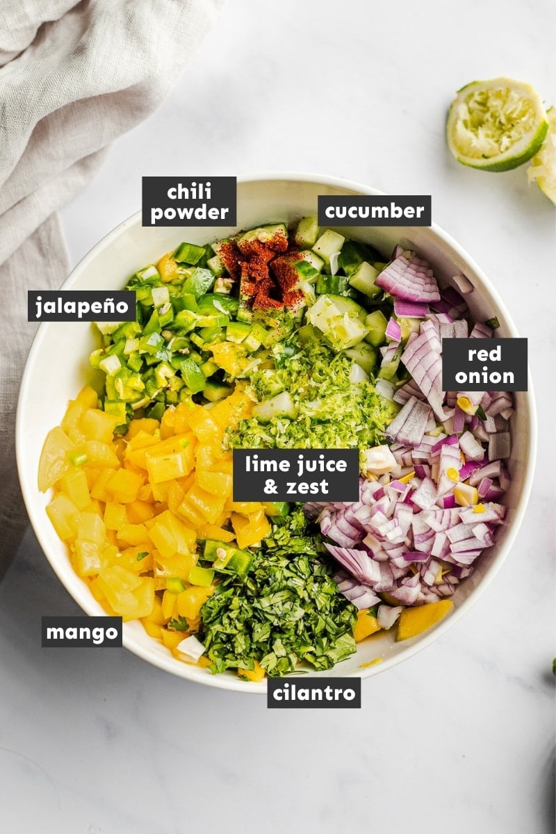 Ingredients for mango salsa in a large mixing bowl.