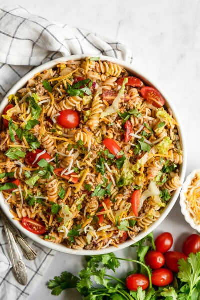 Taco pasta salad in a bowl topped with cilantro.
