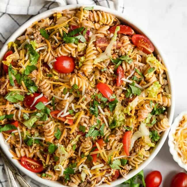 Taco pasta salad in a bowl topped with cilantro.