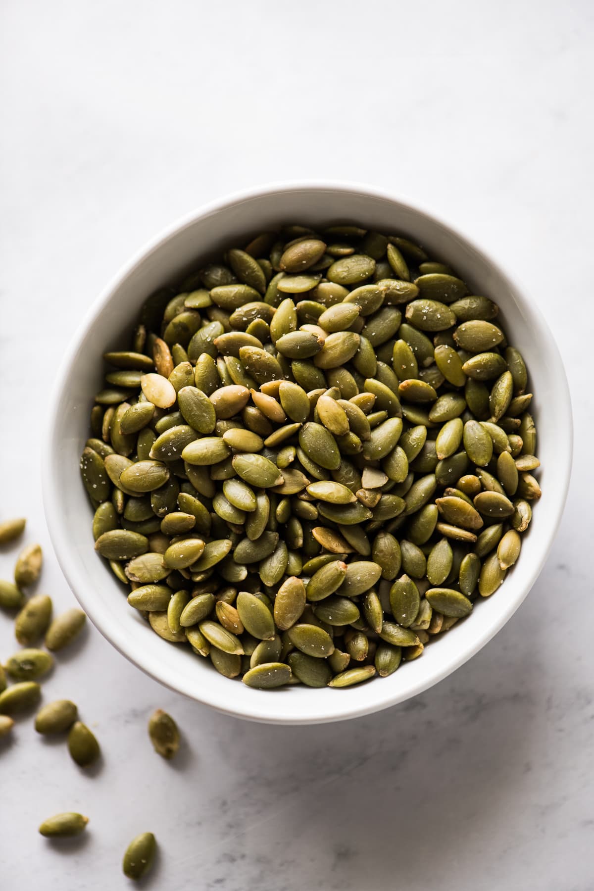 Pepitas (roasted pumpkin seeds) in a small bowl.