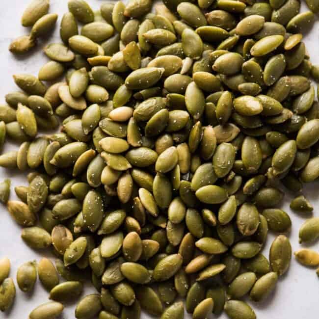 Pepitas (roasted pumpkin seeds) on a table.