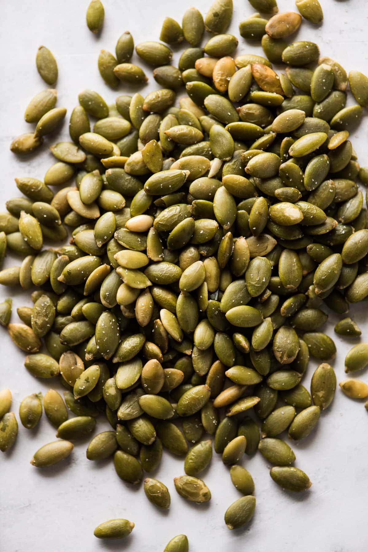 Pepitas (roasted pumpkin seeds) on a table.