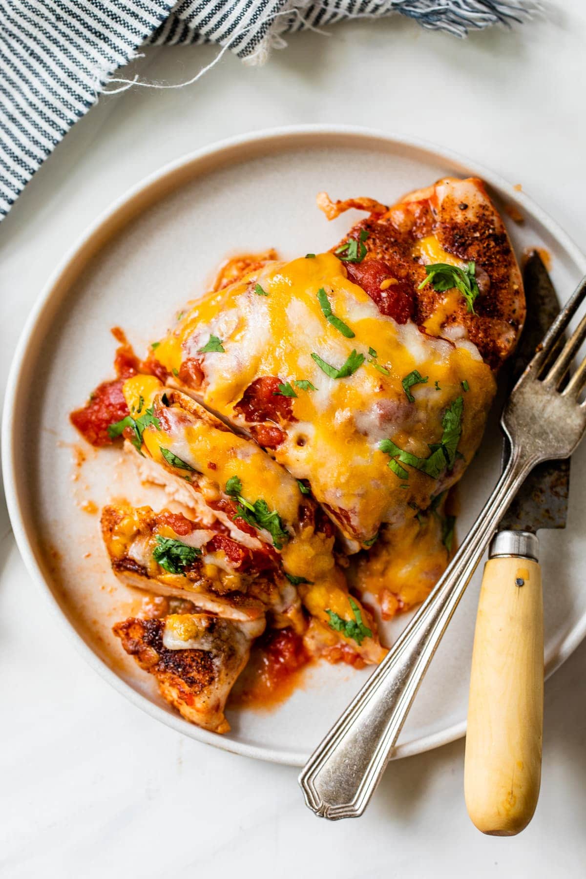 Salsa chicken on a plate sliced and ready to eat.