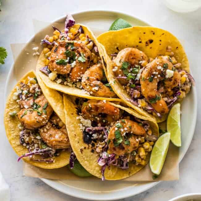 Spicy shrimp seasoned with chipotle chili powder in corn tortillas.