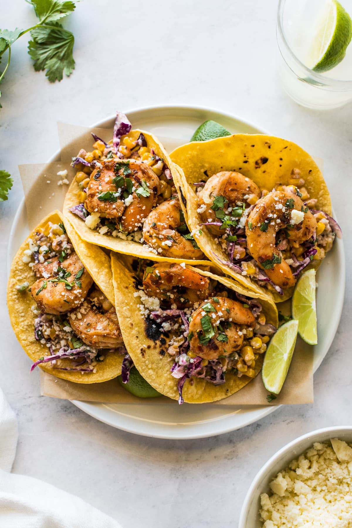 Spicy shrimp seasoned with chipotle chili powder in corn tortillas.