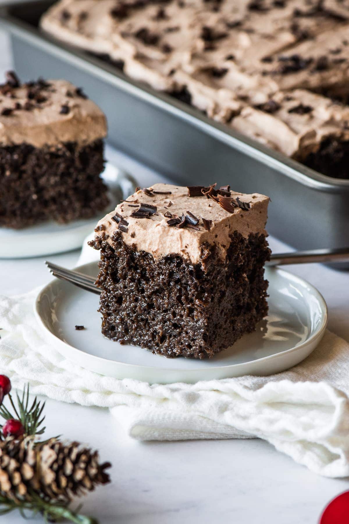 A slice of chocolate tres leches cake.