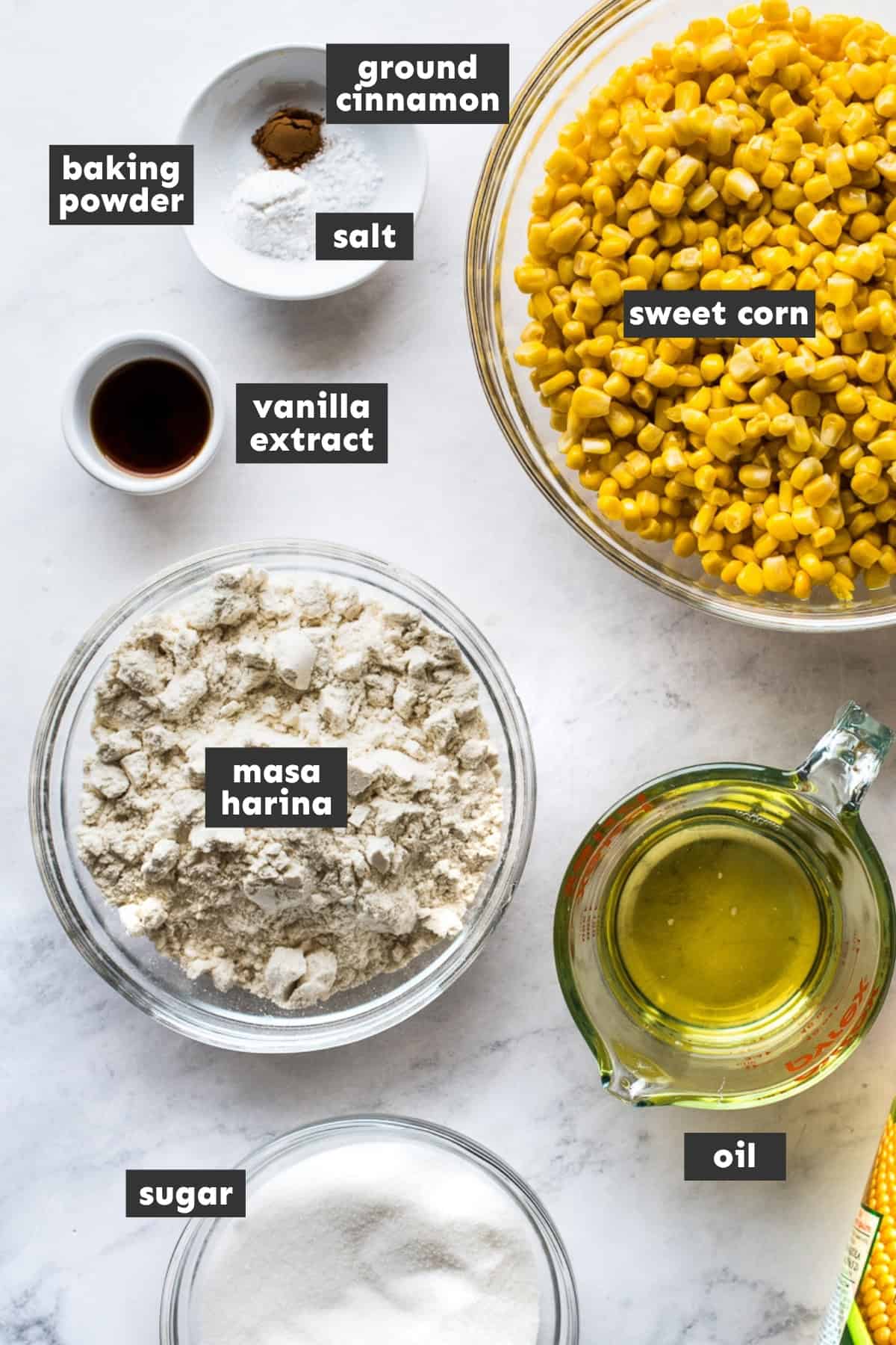 Ingredients for tamales de elote on a table.