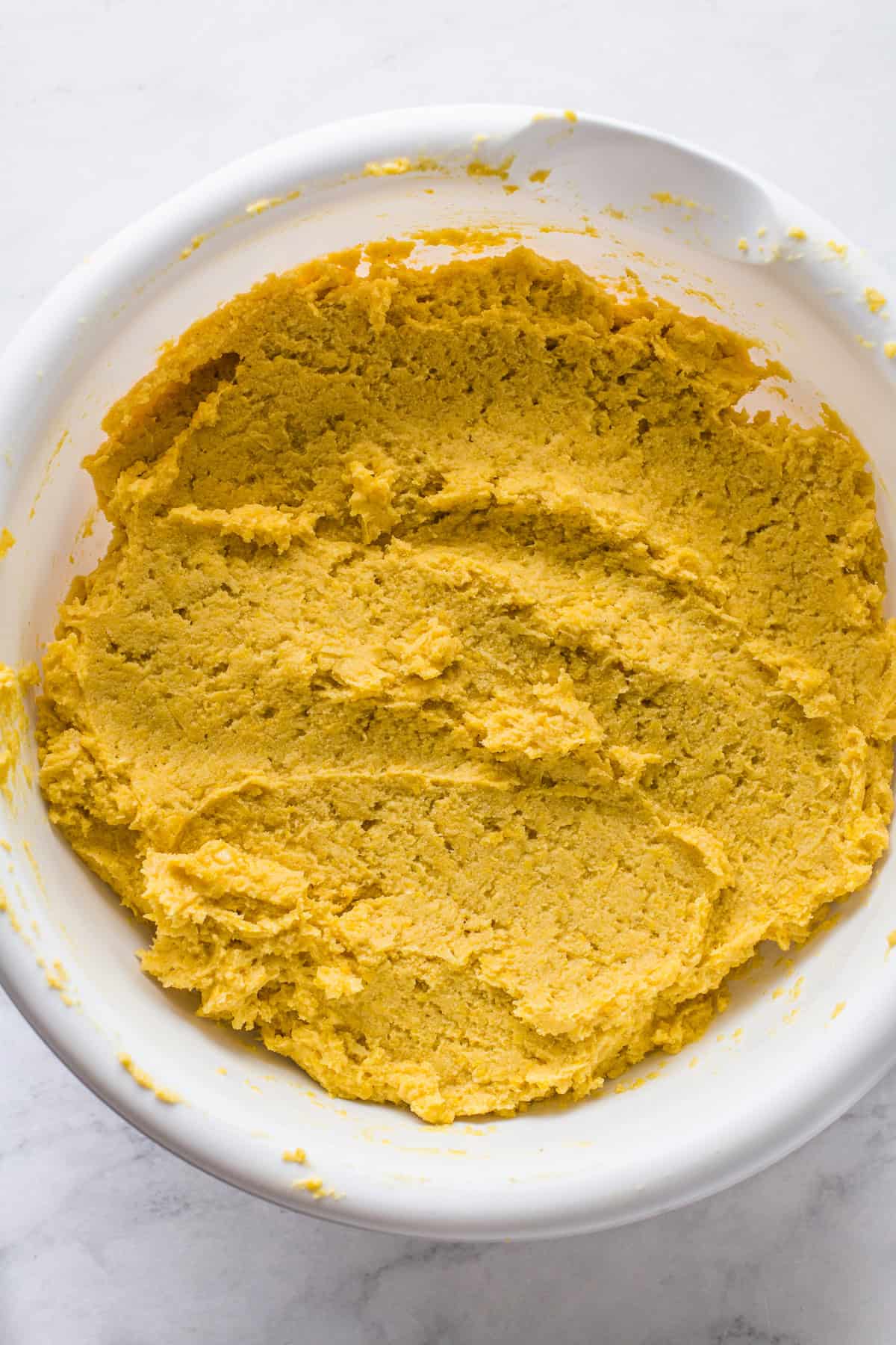 Sweet corn tamale dough mixed into a thick paste.